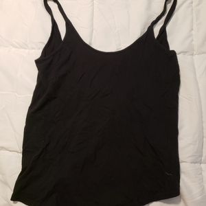 PINK tank top, high in front, low cut in back, oversized fit, size small.